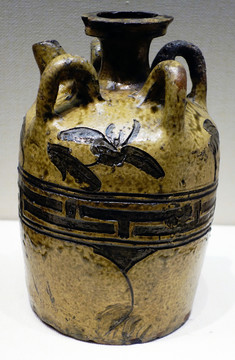 黃釉刻花四系壺