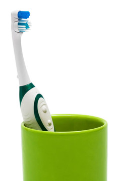 Toothbrush在一個(gè)綠色的玻璃