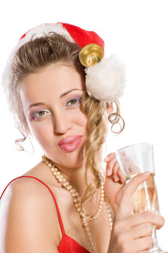 迷人的女孩在Santa與香檳酒杯帽子