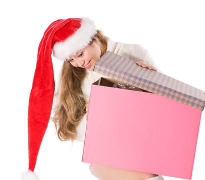 迷人的女孩在Santa與裝飾盒帽子