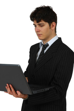 成功的生意人與筆記本電腦的白色隔離BACKGROUNDSuccessful生意人與電腦孤立在白色背景