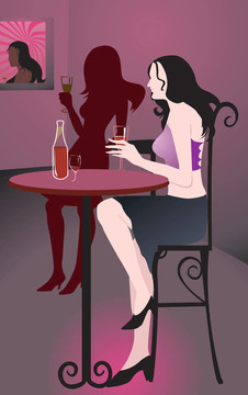 坐在餐館里喝酒的女士