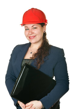 年輕女性建筑師在紅色頭盔和筆記本電腦。白色背景孤立