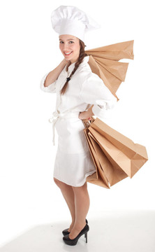 在白色的制服和帽子ekological紙袋女廚師