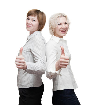 快樂的businesswomans豎著大拇指。關(guān)注手