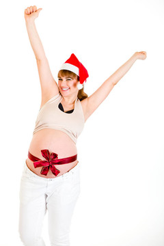 快樂的圣誕孕婦在Santa舉起帽子，雙手在白色上孤立