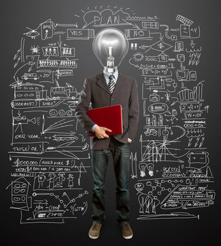 男子在西裝與燈和筆記本電腦在他的手中