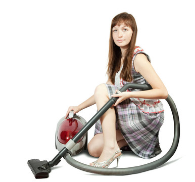 帶真空吸塵器的女孩