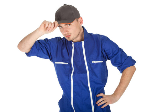 站在藍色工作服的年輕人和棒球帽；系列