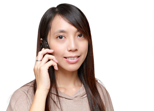亞洲年輕女孩在電話里