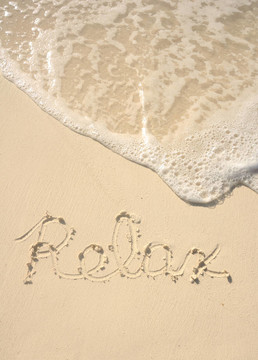 放松寫在沙灘上的Beach