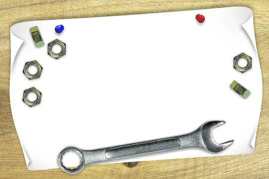 空白的紙上用扳手和螺母
