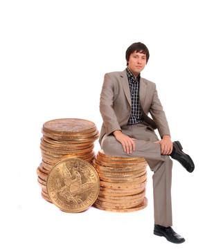 商人坐在金幣上