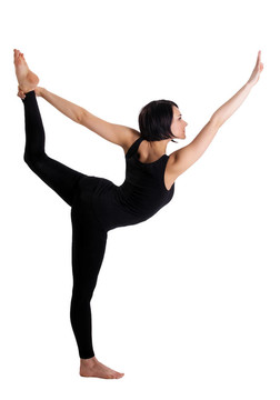 美麗的女人站在瑜伽體式- Dancer Pose