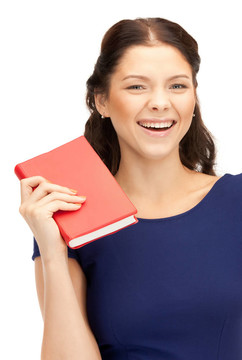 幸福和微笑的女人帶著書