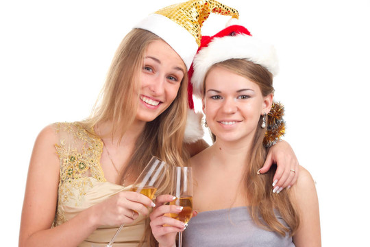 兩個(gè)女孩用手拿禮物和眼鏡慶祝圣誕節(jié)