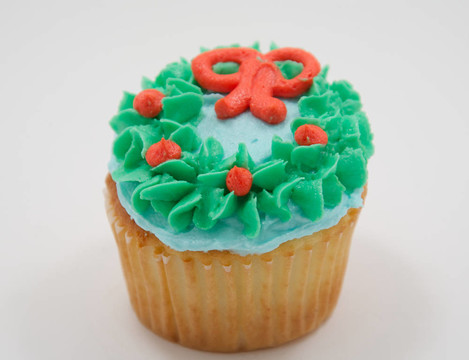 Vanilla cupcake綠色，藍(lán)色和橙色的冰
