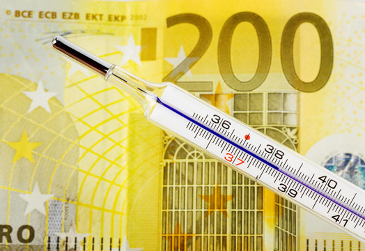 歐元貨幣和溫度計