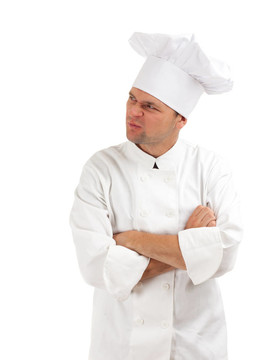 不满或愤怒的厨师在白色制服和帽子
