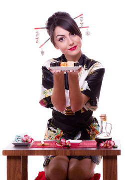 用筷子的女人和壽司卷