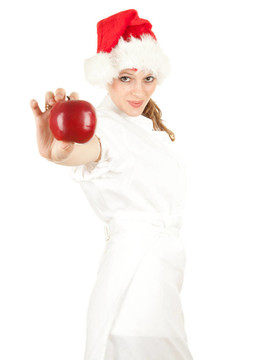 Santa女廚師白色制服和紅色圣誕帽與蘋果