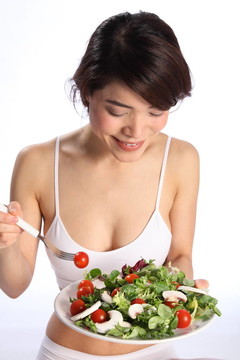 快樂日本女孩吃綠色