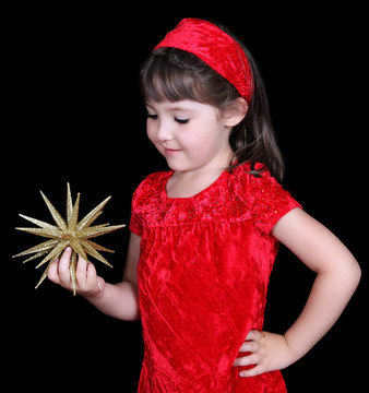 漂亮女孩在圣誕服控股金星