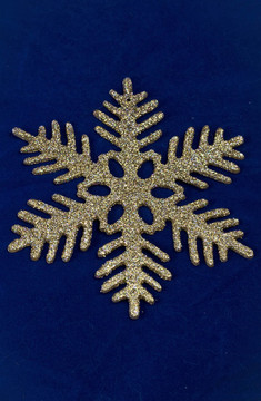 深藍(lán)色背景上的金色雪花