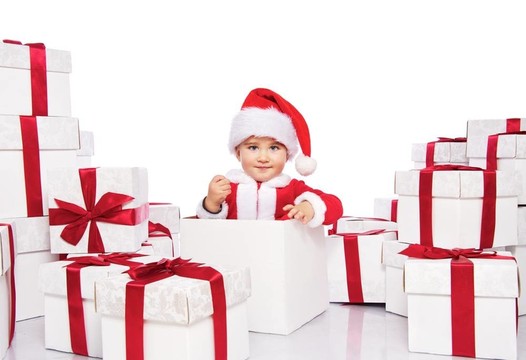 圣誕男孩在圣誕老人克勞斯坐在禮品盒內(nèi)