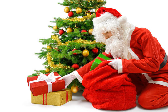 Santa把禮物盒放在圣誕樹(shù)下