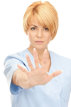 迷人的女醫(yī)生顯示停止手勢(shì)