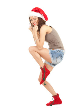 到Santa的女孩在紅色的圣誕帽和紅襪子；白色背景；系列