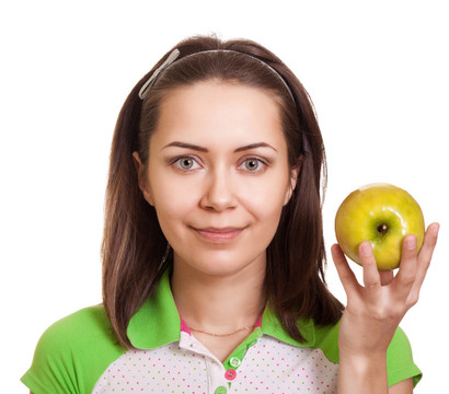 年輕的幸福女人與綠色的蘋果孤立在白色