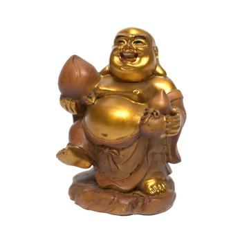 一個微笑的金色如來佛祖雕像