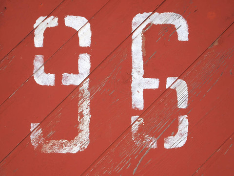 數(shù)字96畫在彩色木材紋理