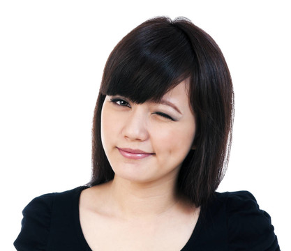 可愛的年輕的亞洲女人眨眼