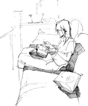 女孩在沙發(fā)上看書(shū)