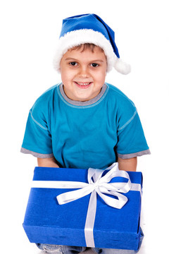 笑小男孩在Santa的帽子與禮品盒