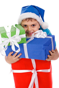 笑小男孩在Santa的帽子與禮品盒