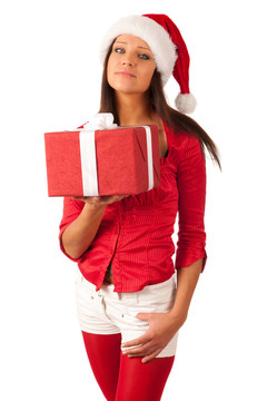漂亮的女孩穿著像Santa的圣誕禮物