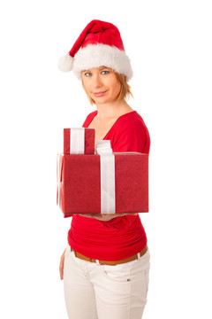 漂亮的女孩穿著像Santa的圣誕禮物