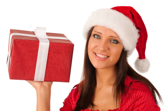 漂亮的女孩穿著像Santa的圣誕禮物