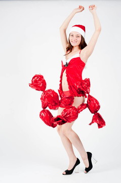 美麗和性感的圣誕婦女與糖果