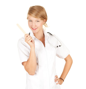 一個美麗的女性醫(yī)療保健醫(yī)生穿白色的制服和聽診器和溫度計