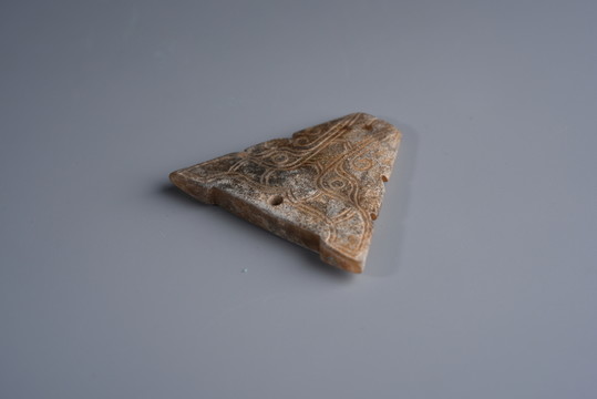 戰(zhàn)國獸面玉佩