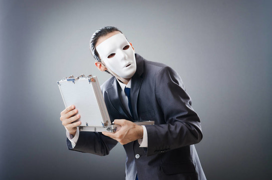 工業(yè)espionate概念與蒙面的商人