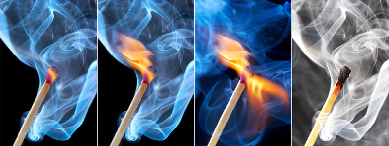 黑色背景煙霧中燃燒火柴的照片
