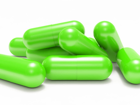 許多綠色光澤的醫(yī)用藥丸（膠囊）