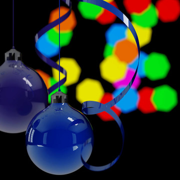 夜晚背景灯上的蓝色圣诞球和彩带