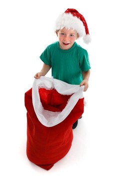 快樂小男孩抱著開Santa麻袋